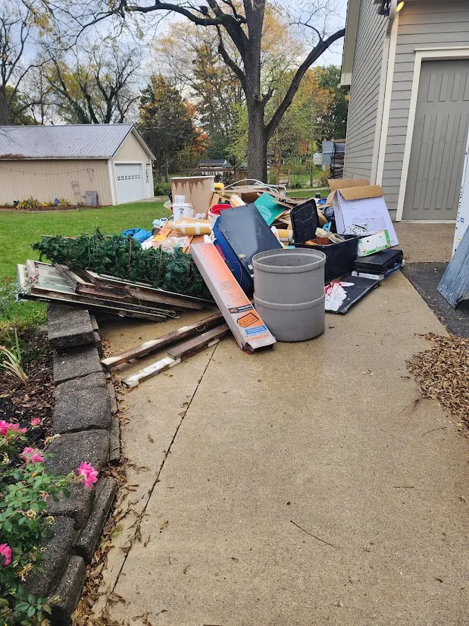 Dumpster being loaded with debris for Commercial Dumpster Rental in Tinley Park